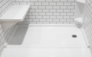 Oldsmar Shower Installation shower pan shower bench closeup client 300x186